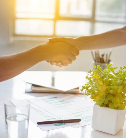 Business partnership meeting concept. Image businessmans handshake. Successful businessmen handshaking after good deal. Horizontal, blurred background